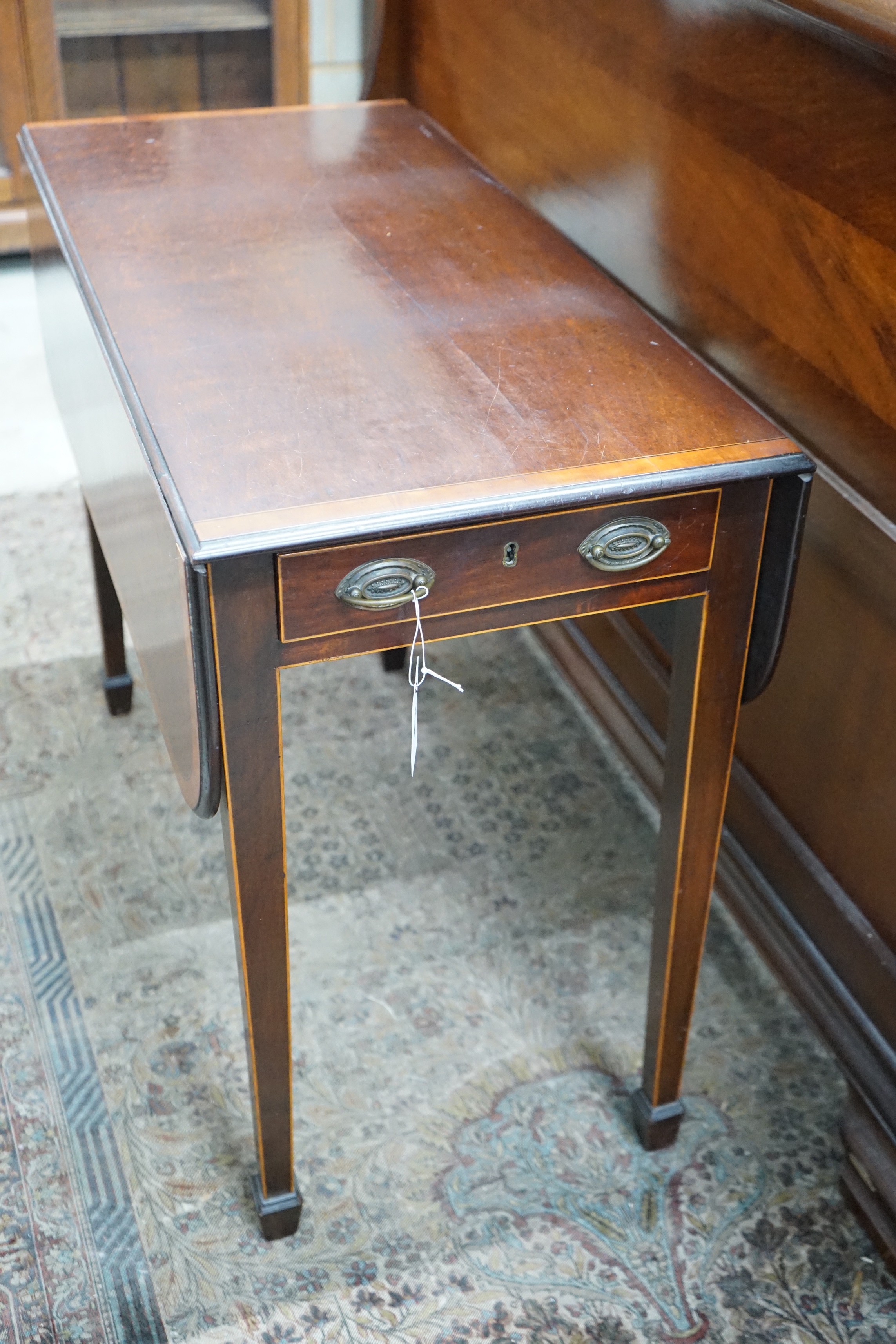 A George III satinwood banded mahogany Pembroke table width 85cms, depth 40cms, height 69cms